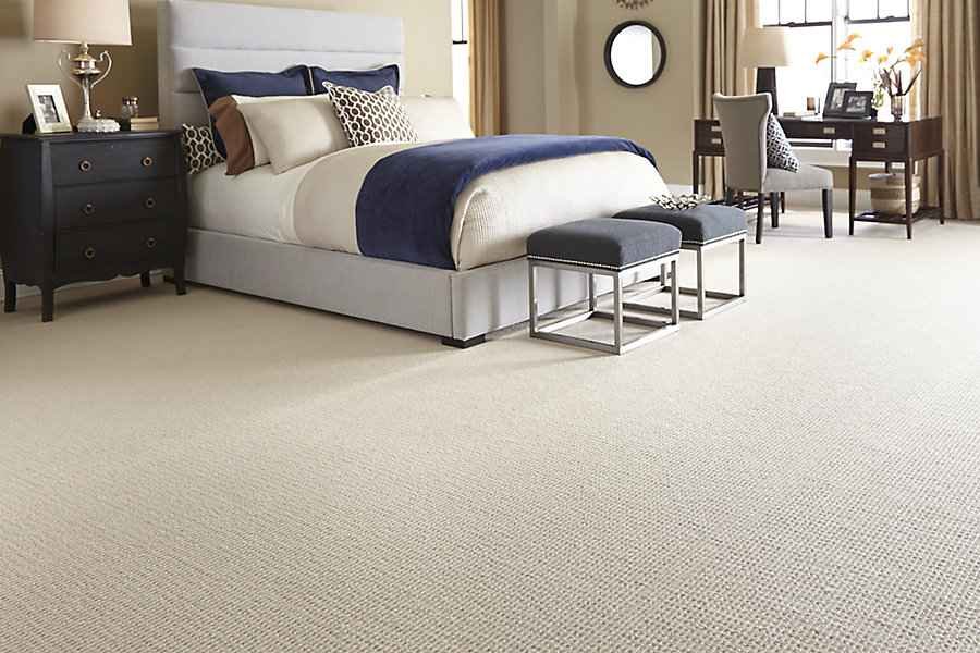 Soft beige carpet in a modern bedroom.